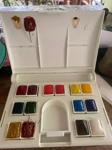watercolor-kit-intact-with-melted-paint.jpeg
